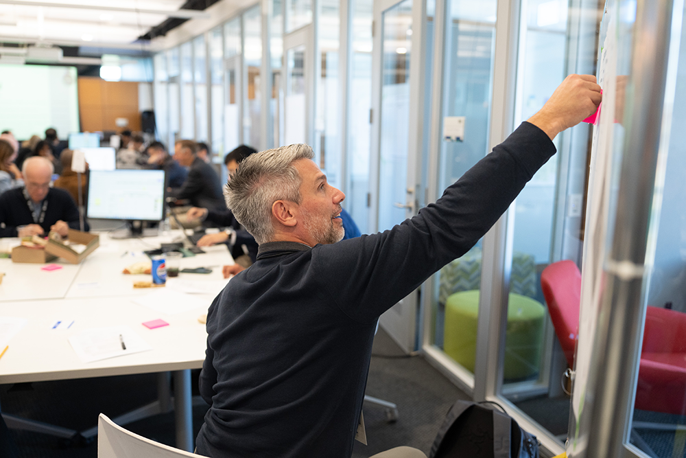 Josh Newman participates in a workshop