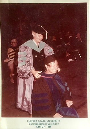 Sandy Shultz getting hooded by Billie Jones