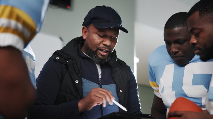 football players and their coach