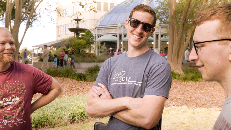 Thomas Bissen talks with colleagues