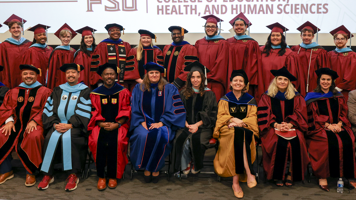 group photo of 2026 master’s and doctoral graduates from the Higher Education program 