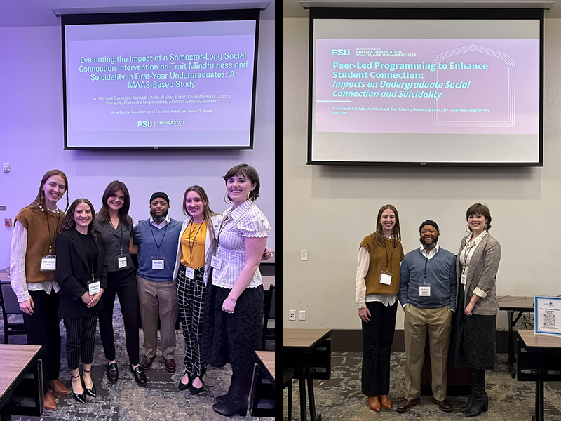 research teams in front of thier posters