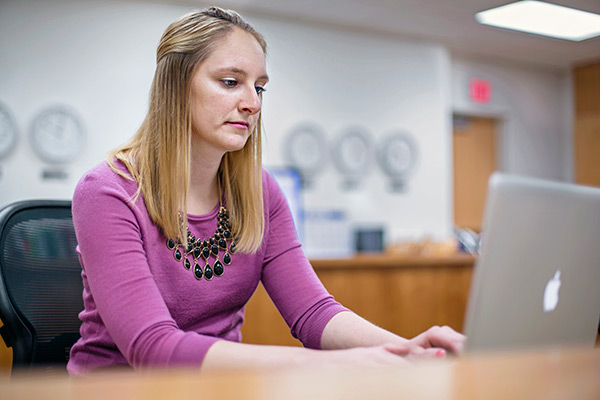 student studying on a laptop computer