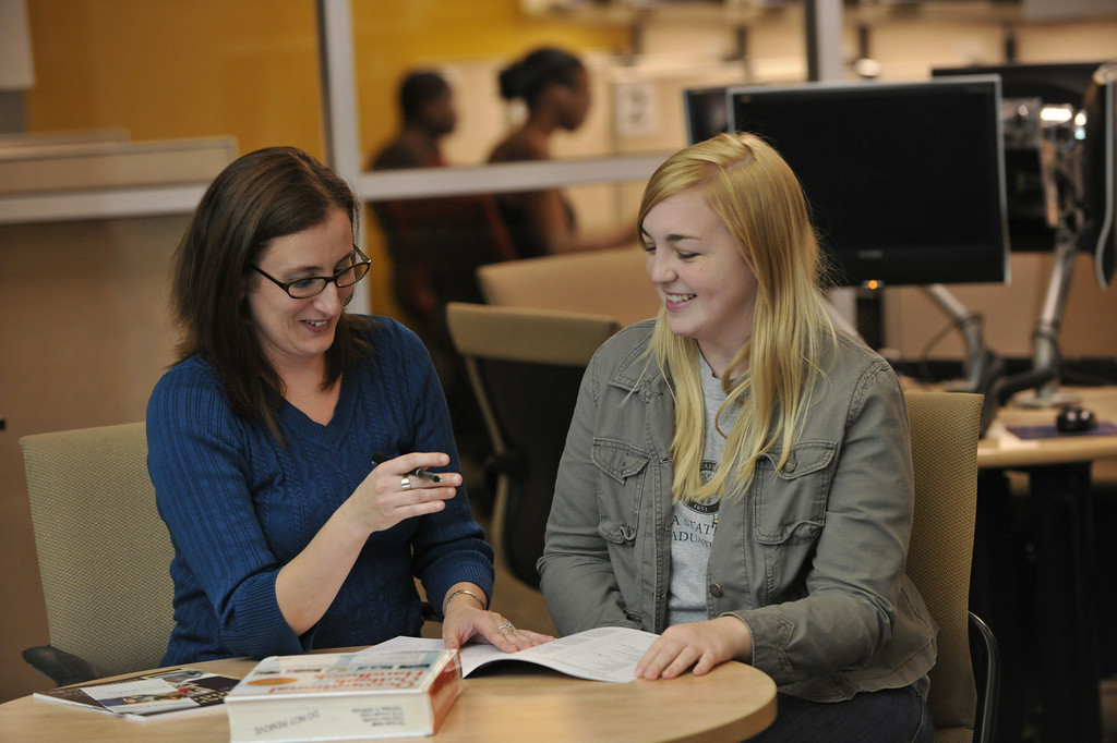 student talking to a teacher