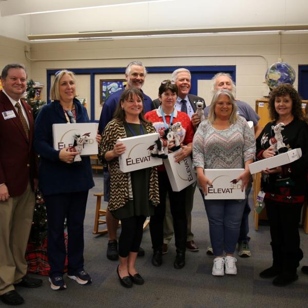 People receiving gifts at school