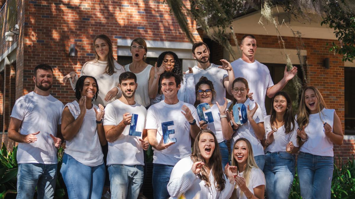 Group of students holding the letters LEGO