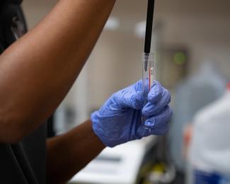 lab worker with test tube