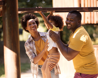 family playing at playground