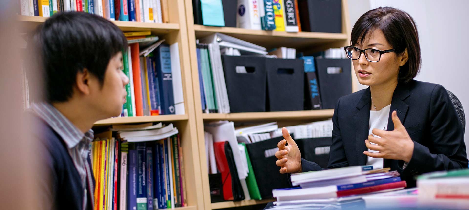 students talking in an office